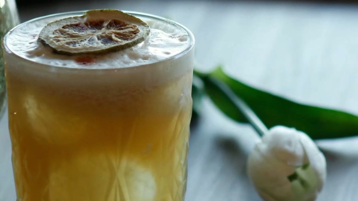 A cocktail garnished with citrus at Luna