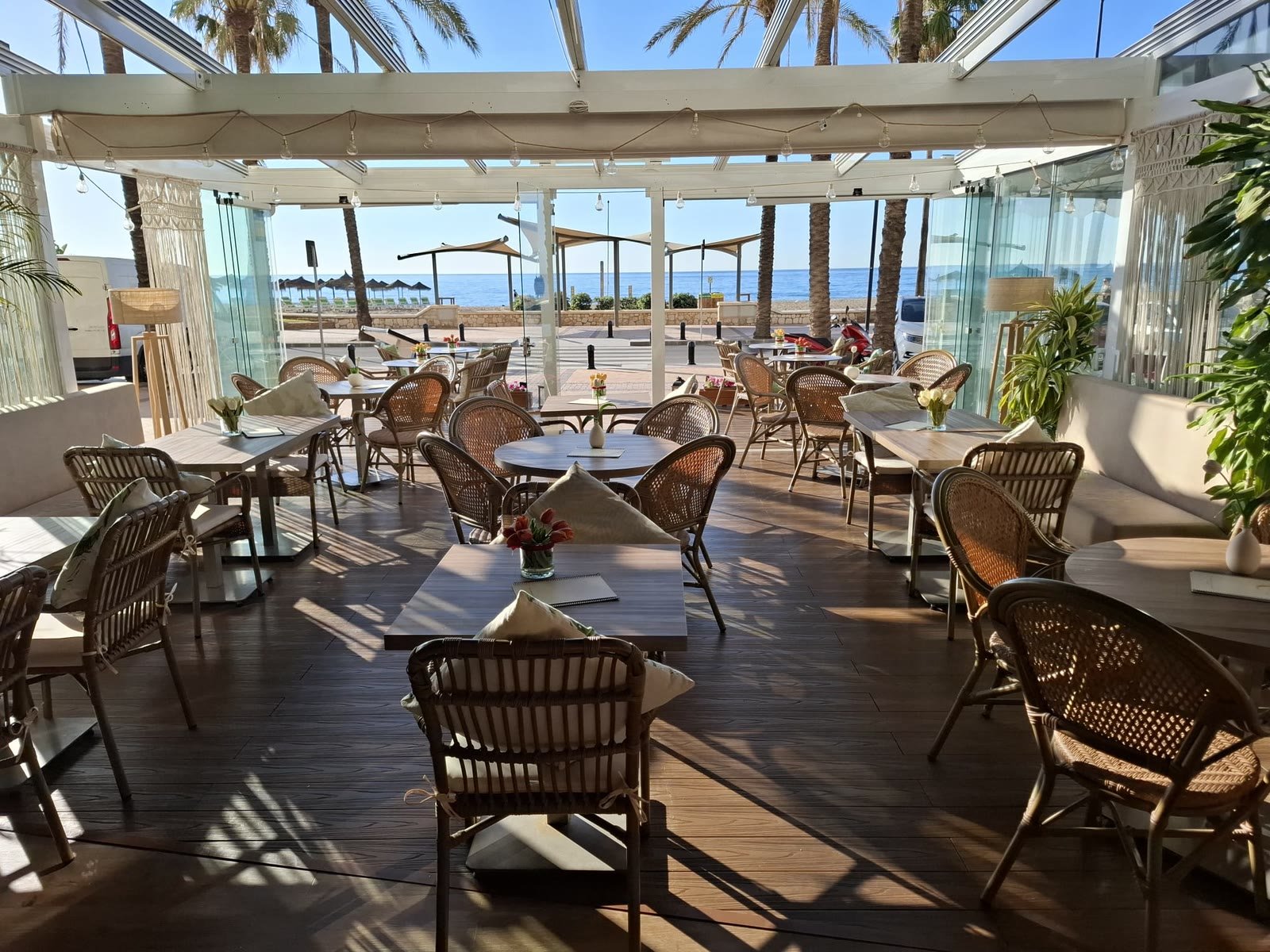 Luna's bright glass terrace looking out to the sea